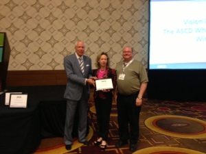 ASCD Executive Director Dr. Gene Carter presents AL ASCD Executive Director Dr. Jane Cobia and President Dr. Patrick Chappell with the "Exceptional Progress Award in the Area of Communications"